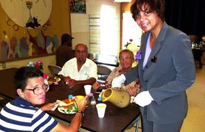 Attached Photo: Beverly Powell, Region Manager/Public Affairs, Southern California Edison, standing on the right serves lunch to disadvantaged families and individuals at Mary’s Mercy Center in San Bernardino.